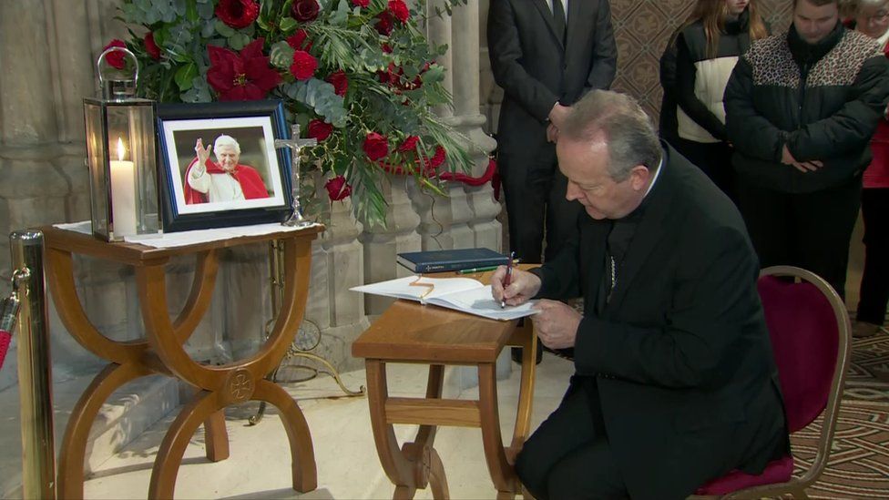 Archbishop Eamon Martin signs book of condolence