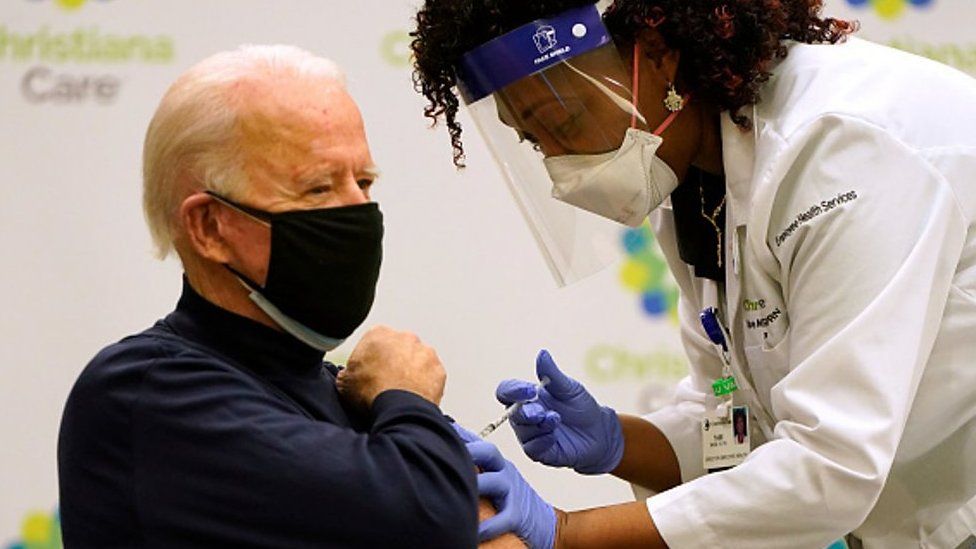A nurse gives President-elect Joe Biden a Covid-19 vaccine