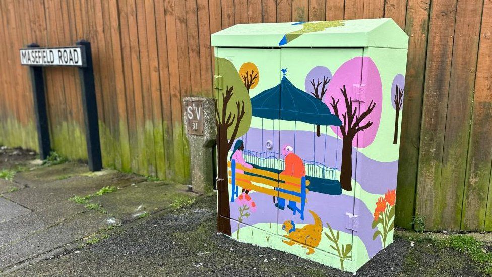Cabinet painted with a bandstand, a pink tree and seated figures