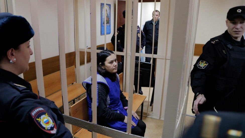 Gyulchehra Bobokulova (C) in a cage at the Presnensky district court in Moscow, Russia, 02 March 2016
