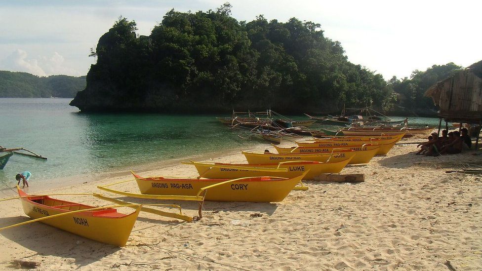 Yellow boats on a beach