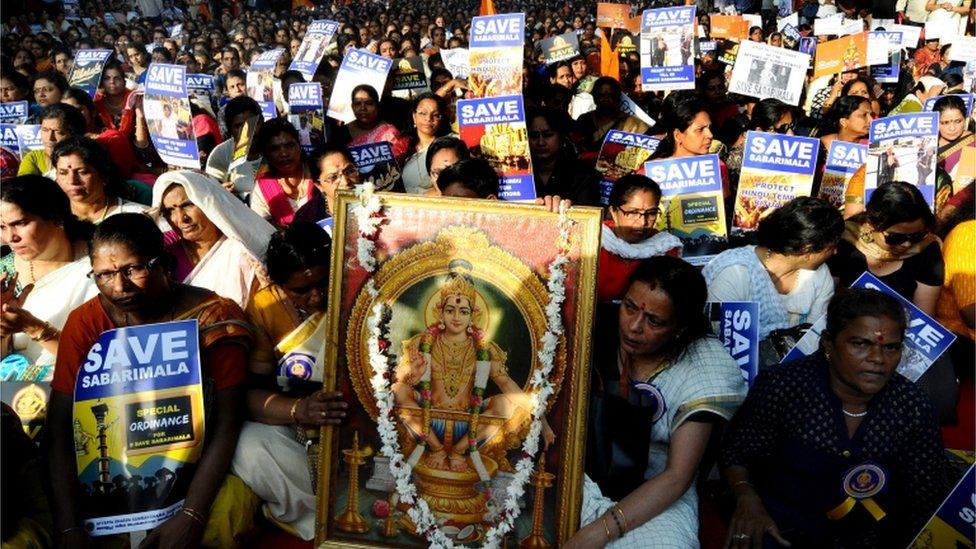 Members and supporters of Ayappa Dharma Samrakshana Samithi (a united forum of South Indian Ayyappa devotees) sit during a peaceful protest demanding special ordinance in relation with women's entry in Sabarimala temple, in New Delhi, India, 14 October 2018.