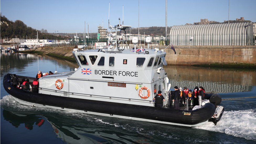 Migrants are brought into the Port of Dover onboard a Border Force vessel after being rescued while crossing the English Channel, in Dover,