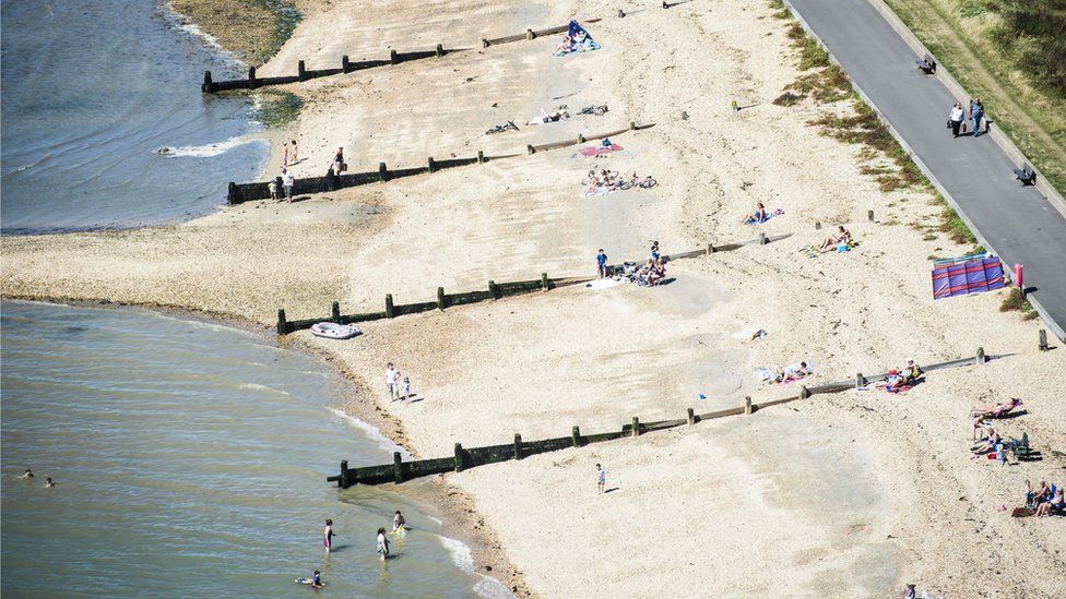 People on the beach at Lee-on-Solent, as parts of the country are set for hot weather
