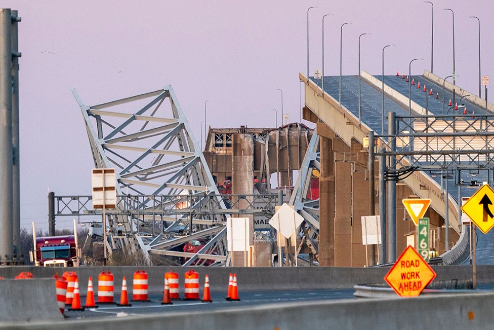 The Francis Scott Key Bridge rests partially collapsed after a cargo ship ran into it in Baltimore, Maryland, USA, on 26 March 2024
