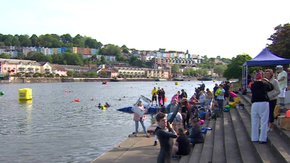 Swimmers and crowds at Bristol Harbour