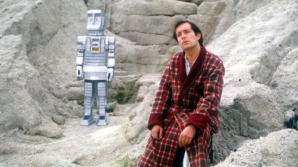 David Learner as Marvin the paranoid android and Simon Jones as Arthur Dent on the set