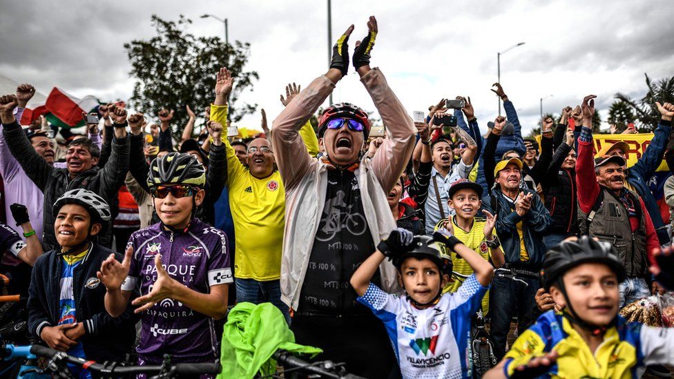 Colombians celebrate as they watch the Tour de France in Zipaquira, Colombia