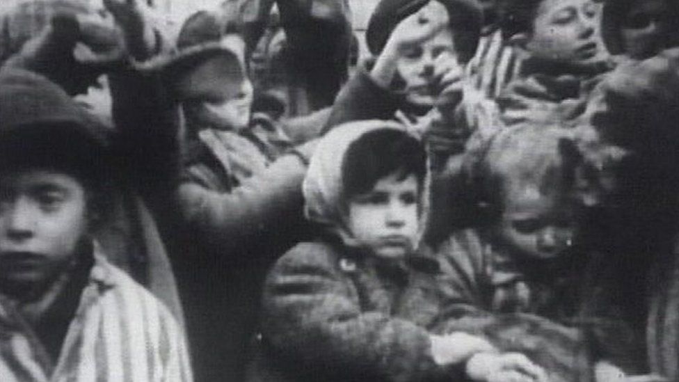 Jewish children are brought to an unidentified concentration camp