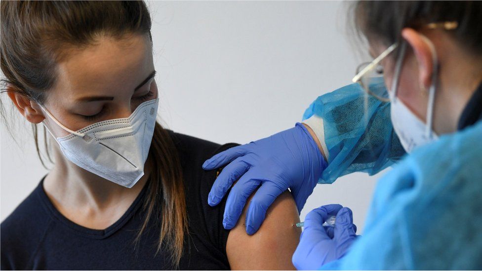 A German police staff member receives AstraZeneca's vaccine against the coronavirus disease (COVID-19), in Munich, Germany,