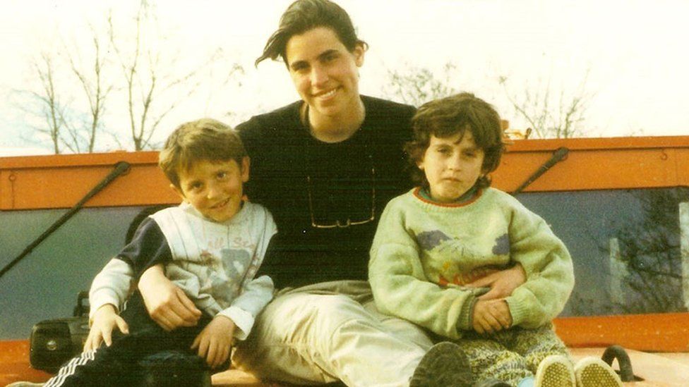 Gemma Morgan in Kosovo with local children