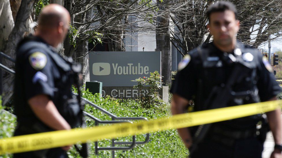 Police officers and crime scene tape are seen at Youtube headquarters
