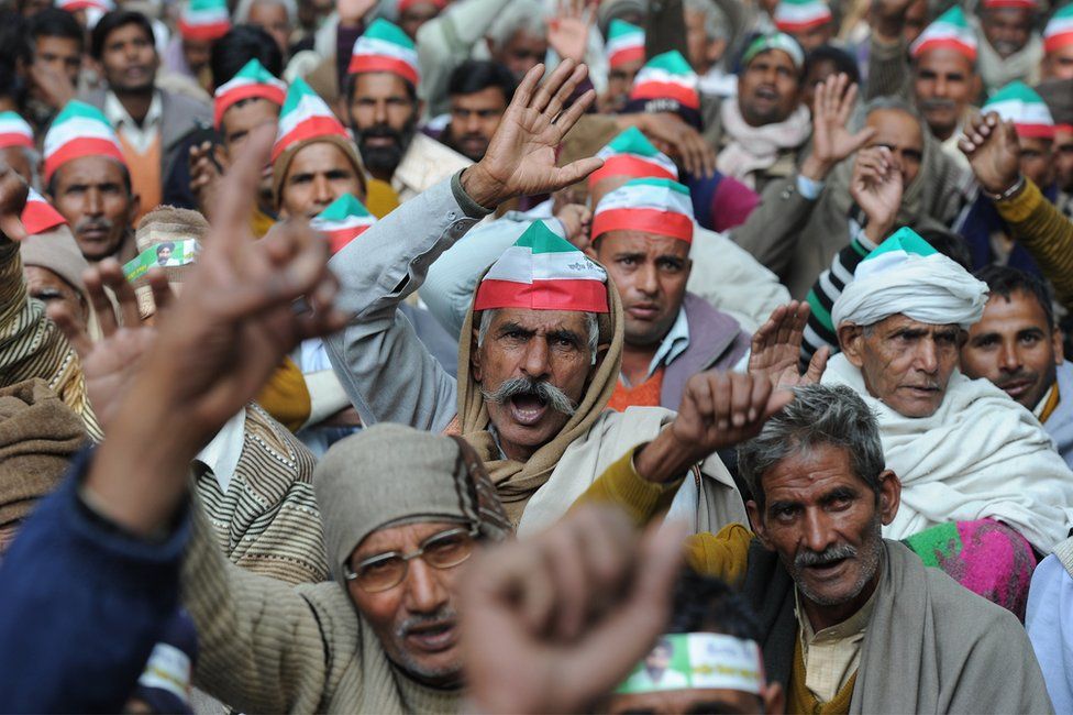 Indian sugarcane farmers shout slogans during a protest in New Delhi on December 4,2012
