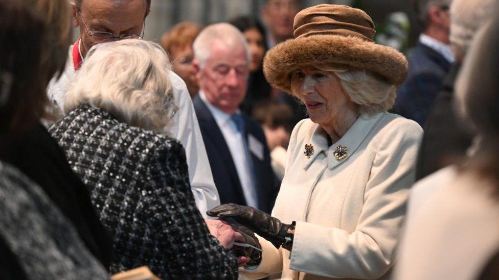 Queen Camilla handing out Maundy money