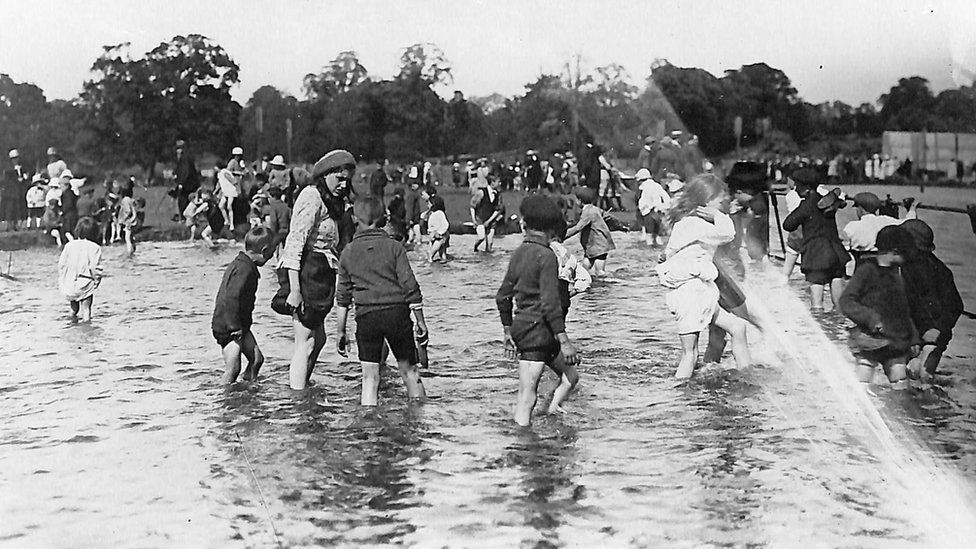 Children playing in the paddling pool in 1921