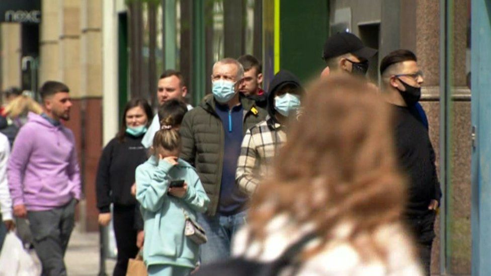 Masked shoppers lining Belfast streets
