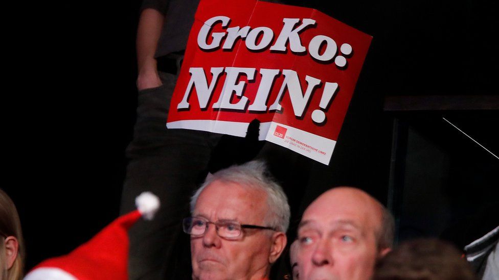 People protest during the SPD's party congress in Bonn, Germany