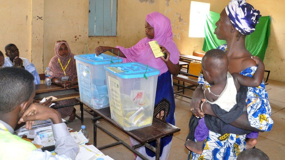 A woman casts her vote in country's constitutional referendum on 5 August at the polling station in Nouakchott