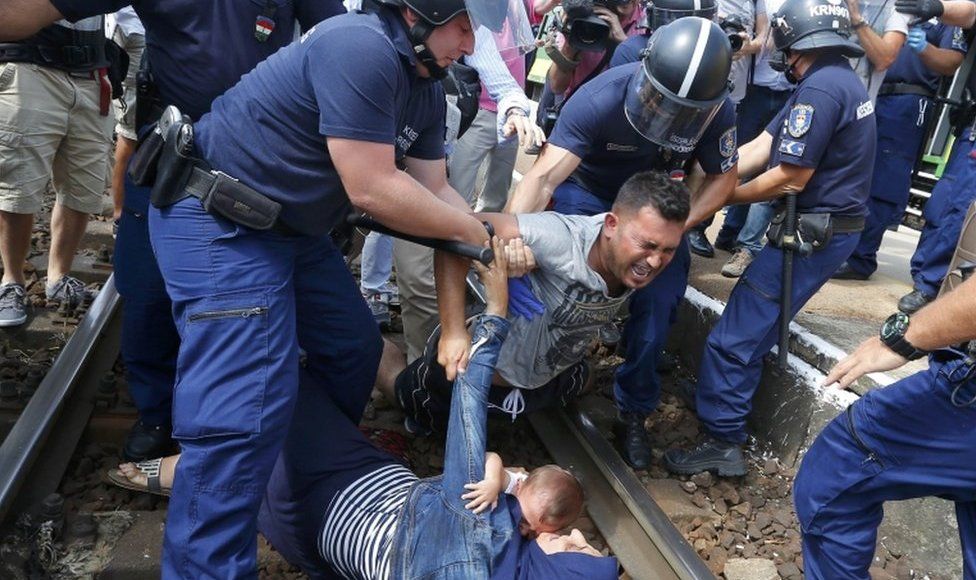 Hungarian police detain migrants at the railway station in the town of Bicske, Hungary, on 3 September, 2015.