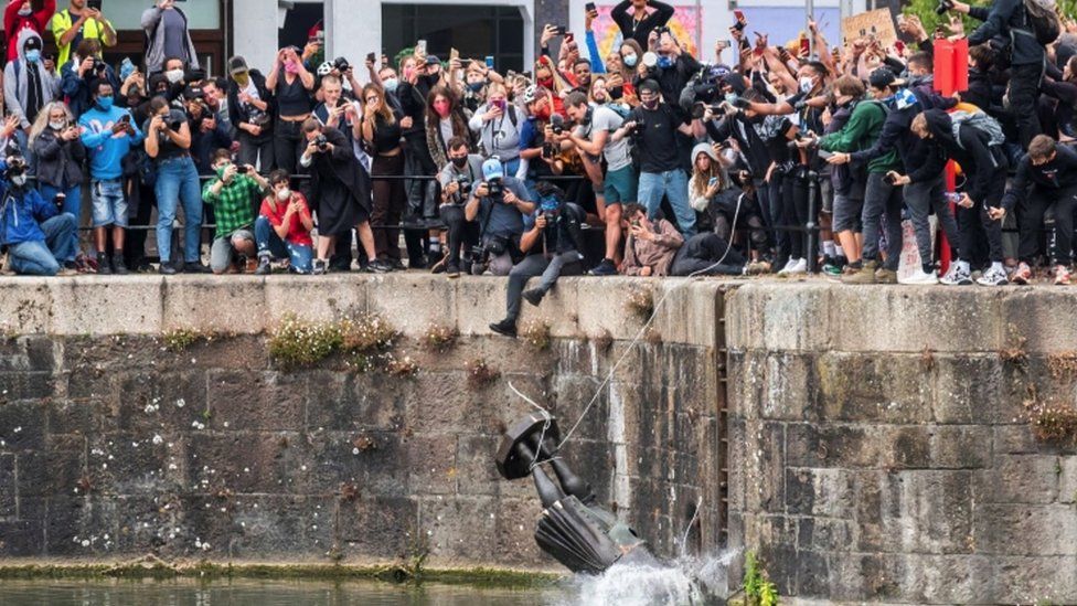 Protestors pushing Edward Colston's statue into Bristol harbour