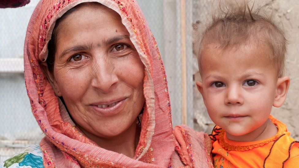 An Afghan woman and her child