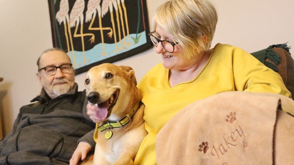 Jake with new owners Veronica and Keith