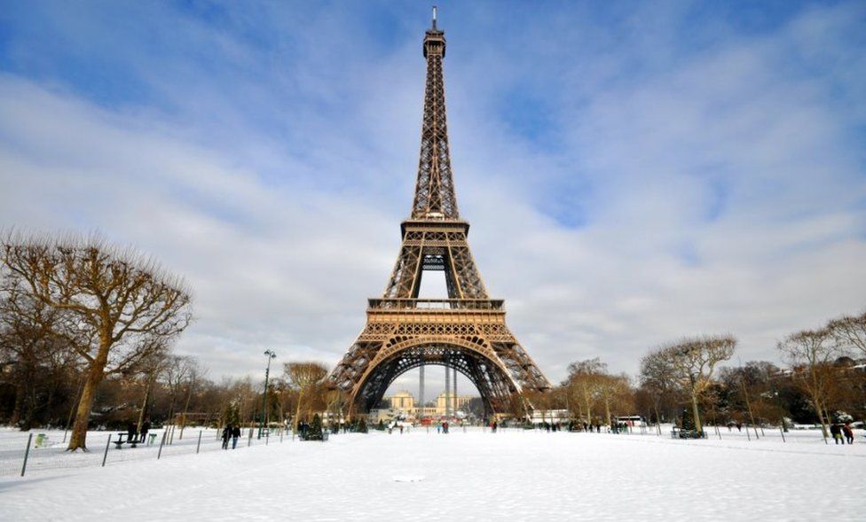 Eiffel Tower with snow surrounding it