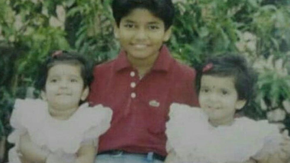 Sarah with her twin sister Maria and her brother Pratik when they were kids