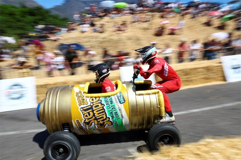 Participants race during the Red Bull Box Cart&Acirc; Race challenges in Bo Kaap, one of the iconic neighbourhoods in Cape Town, South Africa, November 6, 2022.