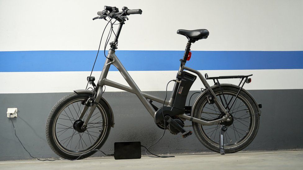 black e-bike with charger