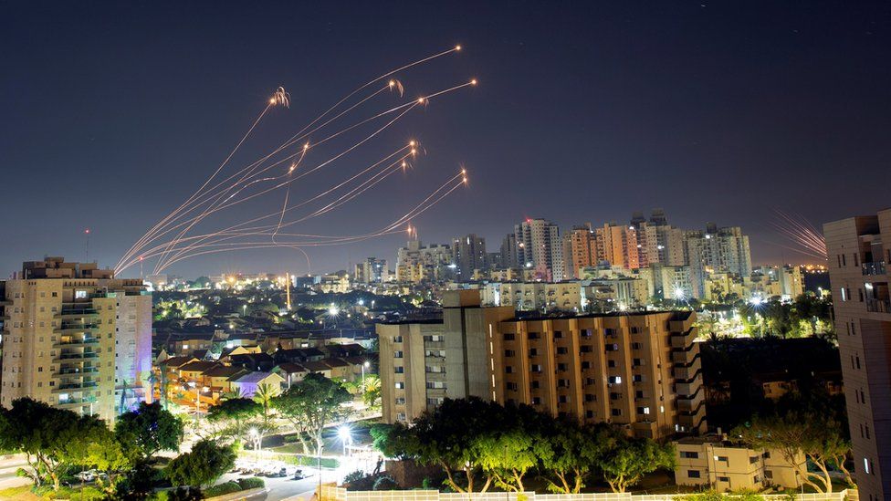 Streaks of light are seen from Ashkelon as Israel's Iron Dome anti-missile system intercepts rockets launched from the Gaza Strip towards Israel (15 May 2021)