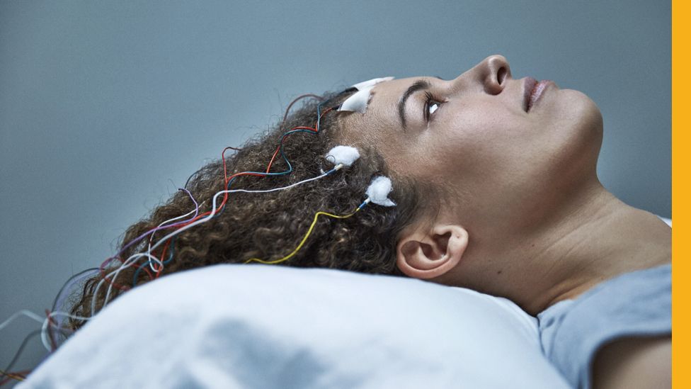 Jennifer Brea with electrodes attached to her head