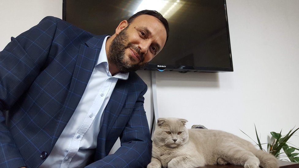 Zeki Celer and his pet cat