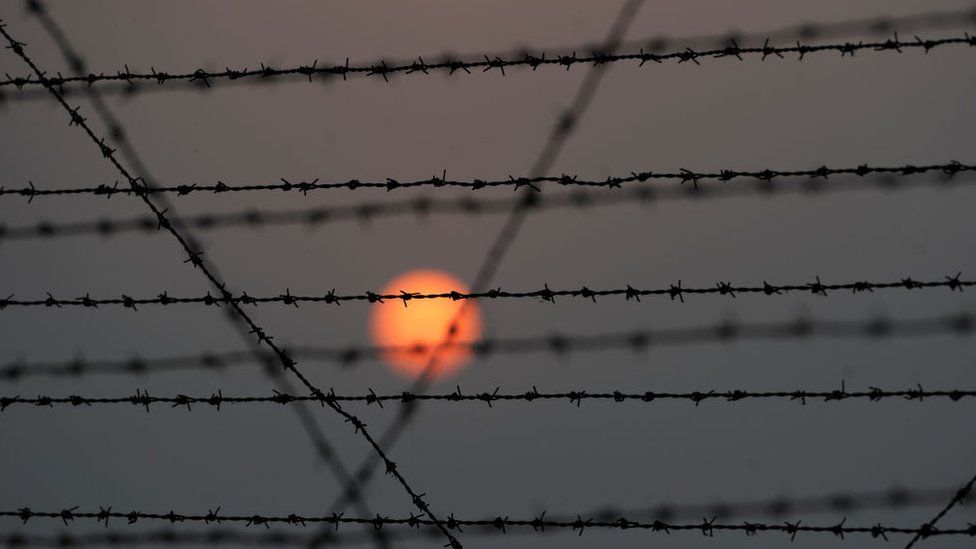 A barbed wire fence is pictured at the India-Pakistan border in R.S Pora, southwest of Jammu, on October 3, 2016.