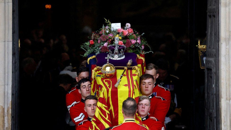 The coffin of Britain's Queen Elizabeth is carried out of Westminster Abbey