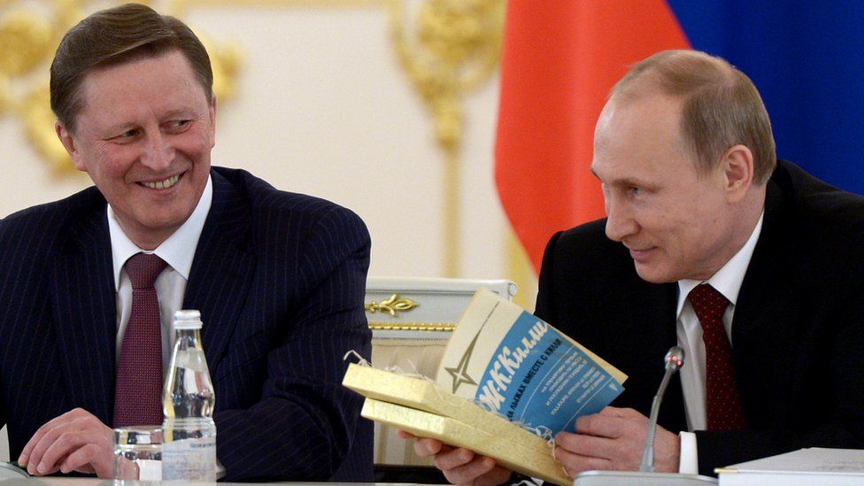 Russian President Vladimir Putin (R) and then Kremlin Chief-of-Staff Sergei Ivanov (L)