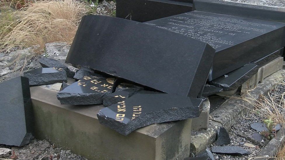 Damaged gravestone