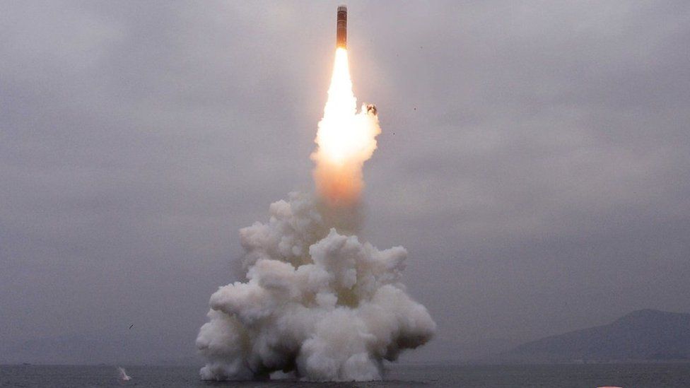 What appears to be a submarine-launched ballistic missile (SLBM) flies in an undisclosed location in this undated picture released by North Korea's official news agency
