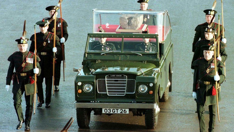 Members of the Royal Archers escort an Army Land Rover carrying the Stone Of Destiny across Edinburgh Castle Esplanade in 1996