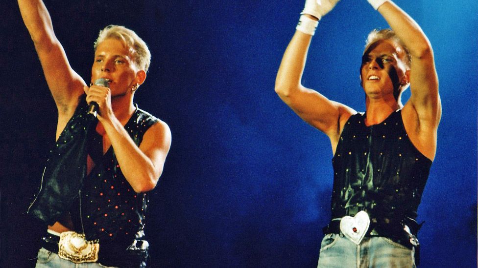 Matt and Luke Goss of Bros perform at Wembley Stadium in 1989