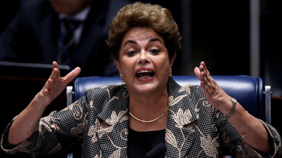 Suspended President Dilma Rousseff speaks while answering a question from a Senator on the Senate floor during her impeachment trial on August 29, 2016 in Brasilia, Brazil. Senators will vote in the coming days whether to impeach and permanently remove Rousseff from office