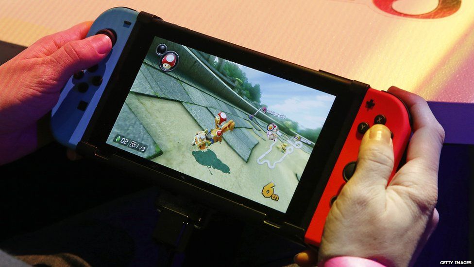 Someone playing Mario Kart on the Nintendo Switch