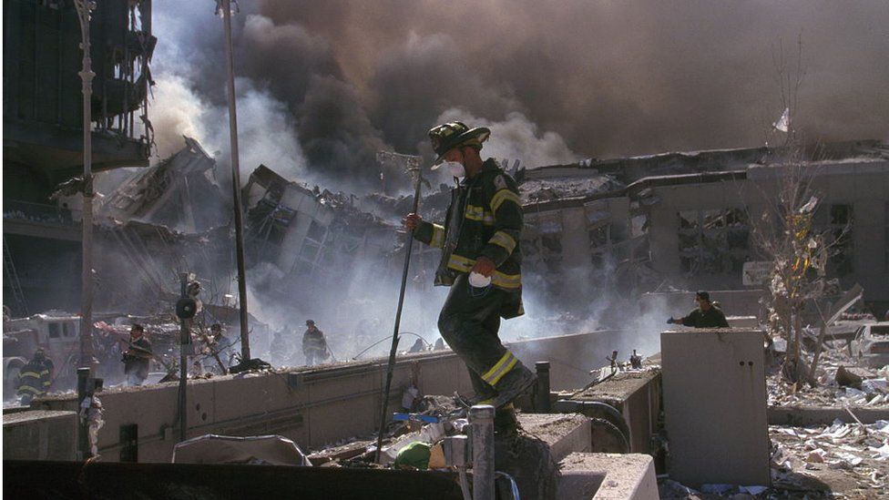 Firefighter in rubble of World Trade Center