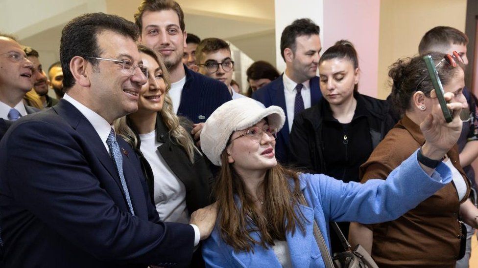 Istanbul mayor and candidate Ekrem Imamoglu (2-L) of the main opposition Republican People's Party (CHP) voted for the local elections at a polling station in Istanbul, Turkey, 31 March 2024