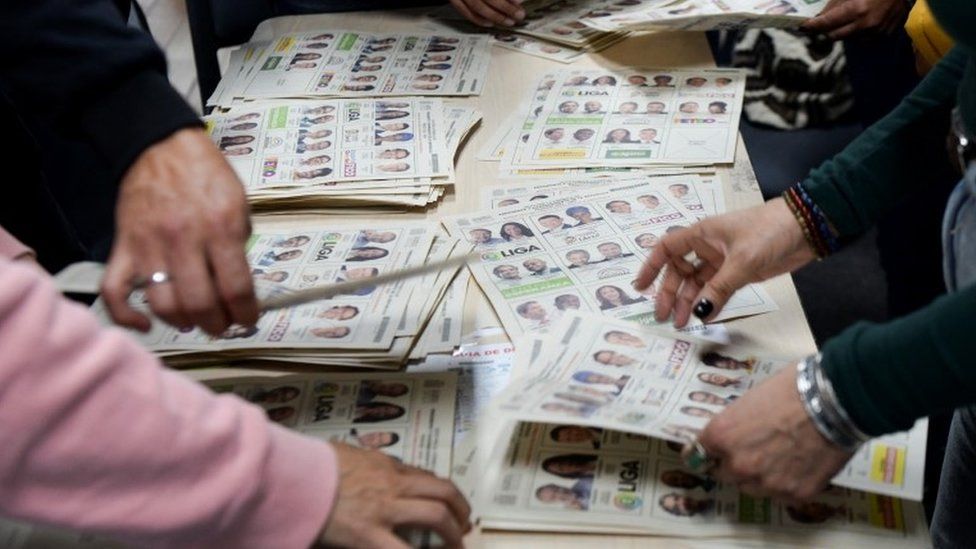 Electoral workers count votes at a polling station during the first round of the presidential election, in Bogota, Colombia May 29, 2022