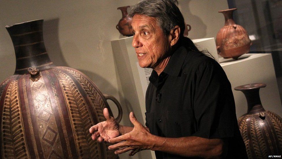Dr. Jose Barreiro (Taino) co-curator, describes a ceramic and painted Inka arybalos, ca. AD 1450-1523 on display at the Smithsonian National Museum of the American Indian press preview of "The Great Inka Road: Engineering an Empire" on Tuesday, June 24, 2015 in Washington, DC. The exhibition opens June 26, 2015. (Paul Morigi/AP Images for Smithsonian National Museum of the American Indian)