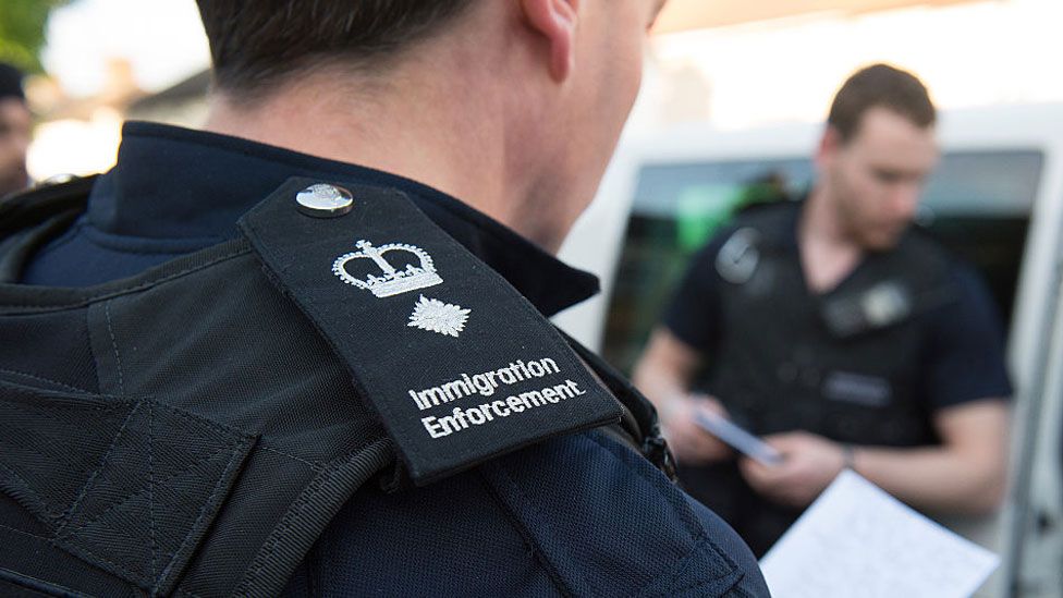 Immigration enforcement officers raid a home in Southall in 2015