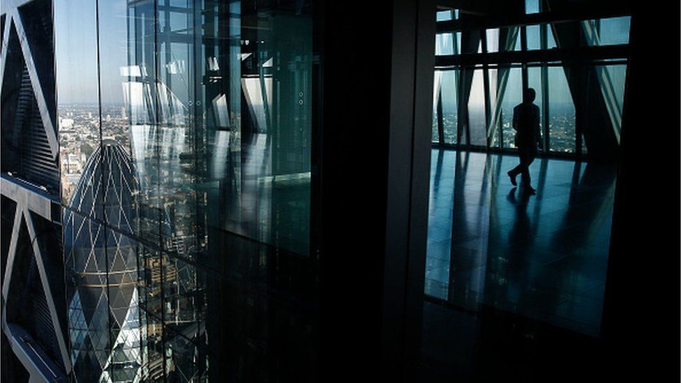 The glass windows of the Leadenhall Building, also known as the Cheesegrater, reflect the Gherkin