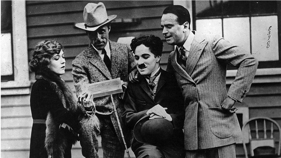 Silent era film stars (from left) Mary Pickford, David Griffith, Charlie Chaplin and Douglas Fairbanks