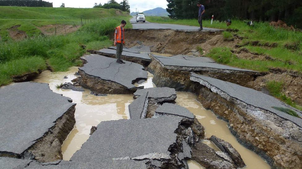 An engineer inspects a ruptured road near Waiau